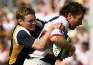 Glen Jackson is tackled by James Brown Glen Jackson is tackled by James Brown