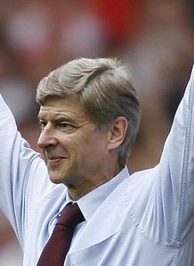 Wenger happy to go top