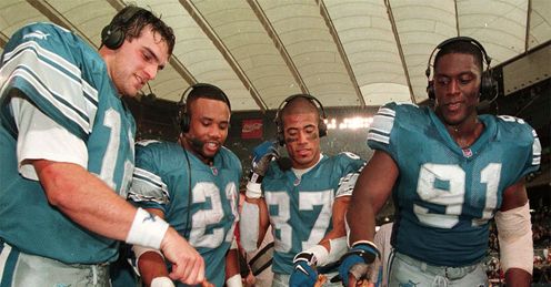 The 1999 Detriot Lions enjoy some Thanksgiving tradition after beating the Bears