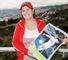 Mrs Ronaldo: holding a mocked-up picture of her son in the white of Real Madrid