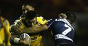 Kylie Leuluai tries to burst through for Leeds Rhinos.