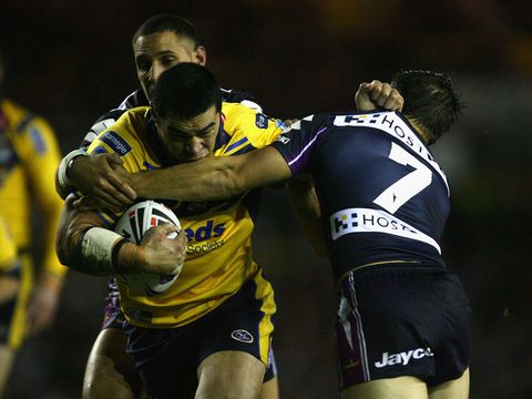 Kylie Leuluai tries to burst through for Leeds Rhinos.