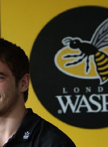 Danny Cipriani with the Wasps logo