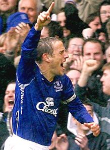 Neville targets top four