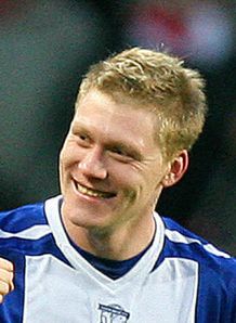Blues march on at top