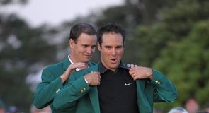 Immelman receives the Green Jacket from last year's winner Zach Johnson
