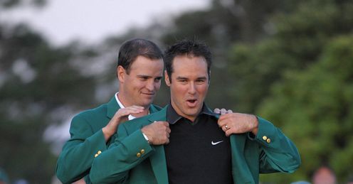 Immelman receives the Green Jacket from last year's winner Zach Johnson