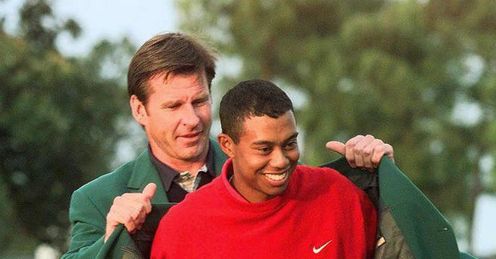 Tiger receives his first Green Jacket from Nick Faldo in 1997 Tiger receives his first Green Jacket from Nick Faldo in 1997