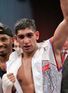 Khan splits with trainer