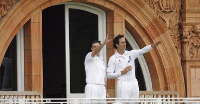 Andrew Strauss and Michael Vaughan study the gloomy skies as rain delays the start.