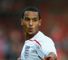 Walcott rues early call-up