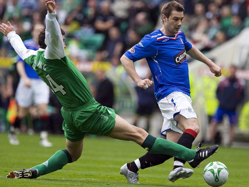 Martin Canning tackles Kevin Thomson Hibs v Rangers