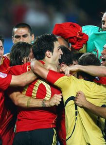 Fabregas is mobbed by his team-mates after dispatching winner Fabregas is mobbed by his team-mates after dispatching winner
