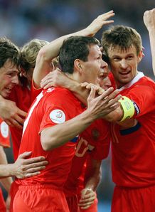 Zyryanov is mobbed by his team-mates Zyryanov is mobbed by his team-mates