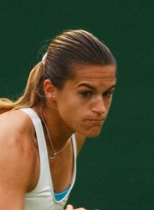 Mauresmo scrapes through