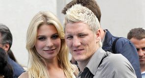 Bastian Schweinsteiger and Sarah Brandner arrive at training for Euro 2008