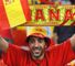 Go on: A Spanish fan gets in the mood before kick-off