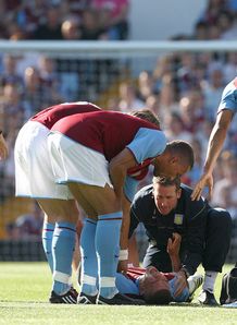 Wilfred Bouma screams in pain Aston Villa v Odense