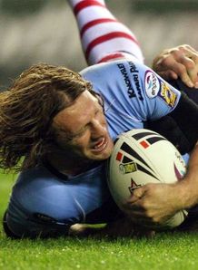 Sean Long St Helens scoring a try against Wigan at the JJB Stadium