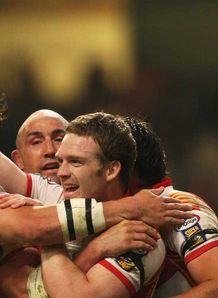 Justin Murphy Catalans Dragons celebrating a try with team-mates