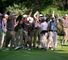 Mobbed: The US team charge onto the 17th green at Brookline in 1999 to congratulate Justin Leonard