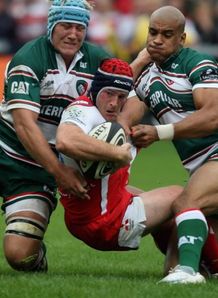 Andy Titterrell is wrapped up by Leicester Andy Titterrell is wrapped up by Leicester