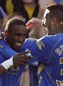 Jermain Defoe left celebrates his second goal with Nadir Belhadj right Pompey v Middlesbrough