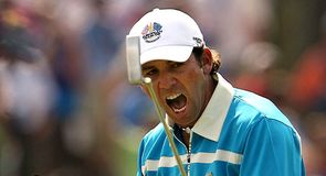In the afternoon's fourballs Garcia cheers on Europe as he sinks a putt on the eighth.