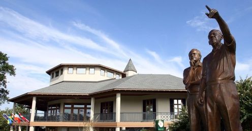 The Valhalla clubhouse with statues of designer Jack Nicklause and founder Dwight Gahm (R)