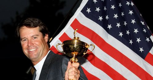 Victorious US captain Paul Azinger poses with Ryder Cup trophy