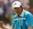 In the afternoon's fourballs Garcia cheers on Europe as he sinks a putt on the eighth.