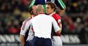 Hurt: Jonny Wilkinson is treated after a fierce hit