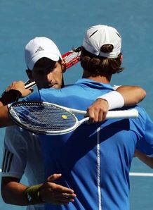 Djokovic and Delic embrace after their match. I dont see any animosity there.
