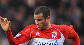 Bates happy to stay