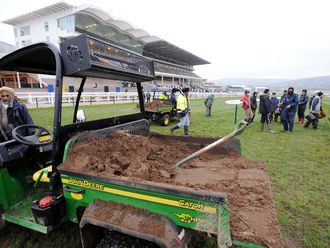 Officials prepare the ground ahead of the action.