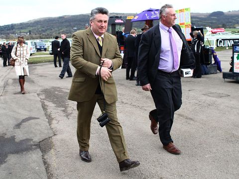 Trainer Paul Nicholls arrives at the course.