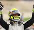 Button cruises to third win