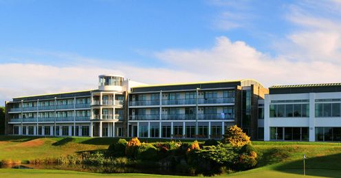 Rooms in the new hotel overlook the 18th green.