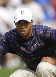 Tiger assumes halfway lead
