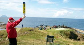 A marshall looks back to the 9th tee.