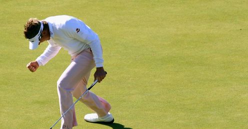 Poulter celebrates his putt on 18 last year.