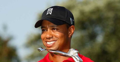 Tiger Woods with his Buick Open trophy