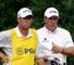Phil Mickelson discusses a shot with Bones McKay.
