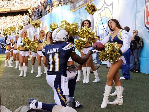 Legedu Naanee shows his generous side after scoring a touchdown in the Chargers' 31-23 win over the Eagles.