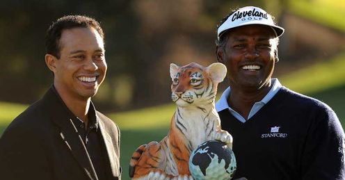 Tiger presenting Vijay Singh with winners trophy last year