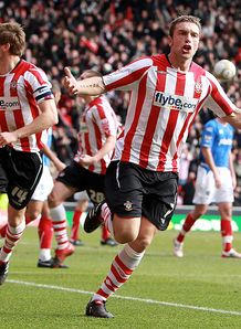Lambert double lifts Saints