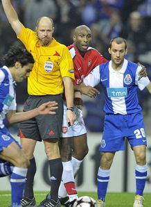 The ref blocks Sol Campbell against Porto