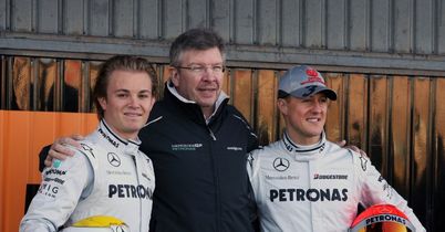 Michael Schumacher and Nico Rosberg and Ross Brawn MGP W01