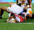 Lining up: Wandile Mjekevu, of the Lions, scores despite Stephen Donald's attentions
