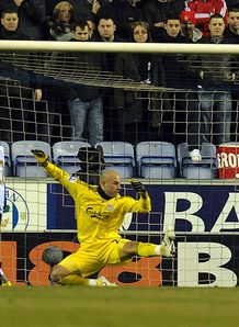 Latics defy lacklustre Reds